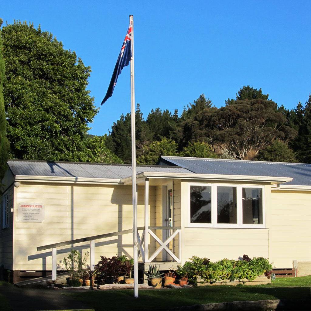 The New Zealand Flag flying over the administration block